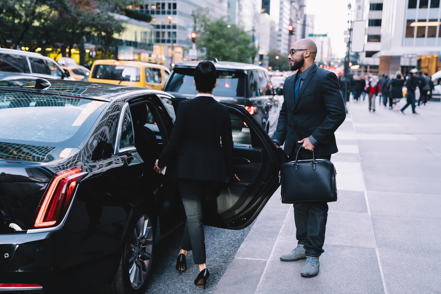 successful business partners getting in car at cit 2024 05 28 17 44 19 utc 1.jpg